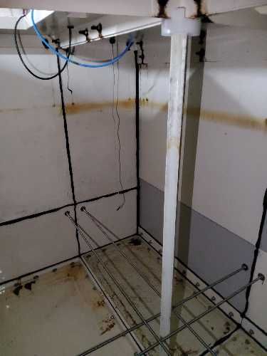 Cold water storage tank cleaning in progress at occupied student accommodation