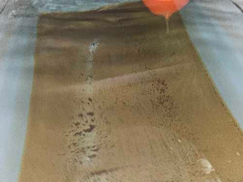 Severe sediment build-up inside cold water storage tank at residential apartment block